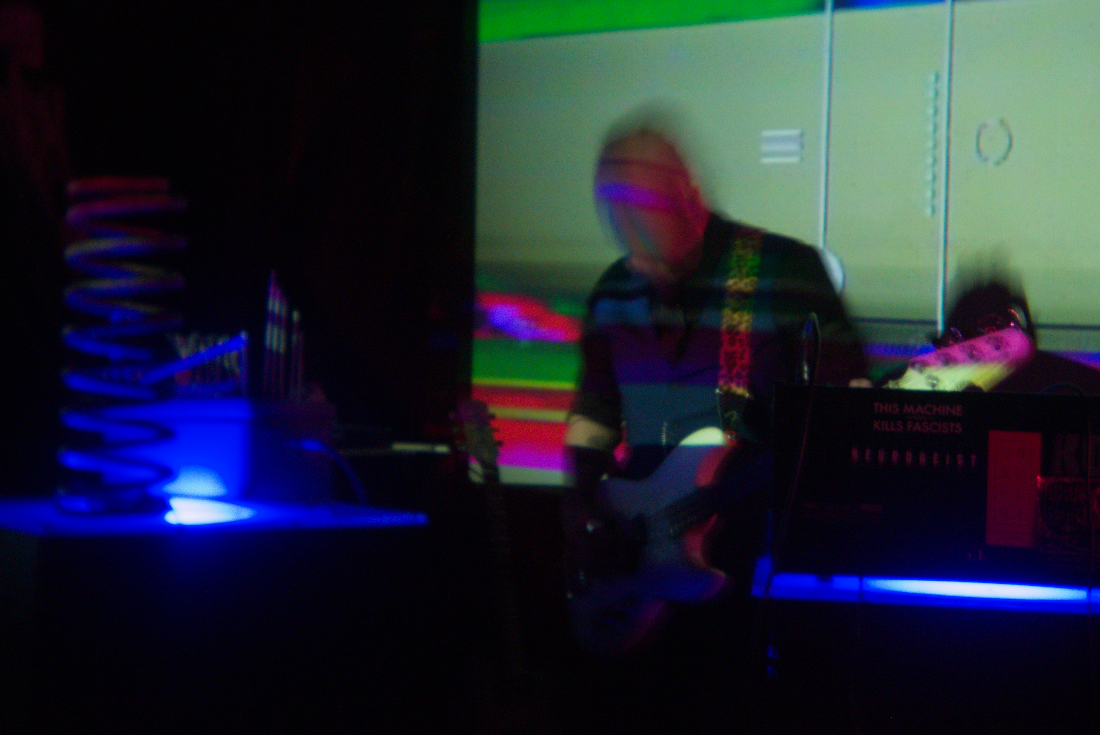 2025 — Guitarist lit by projections